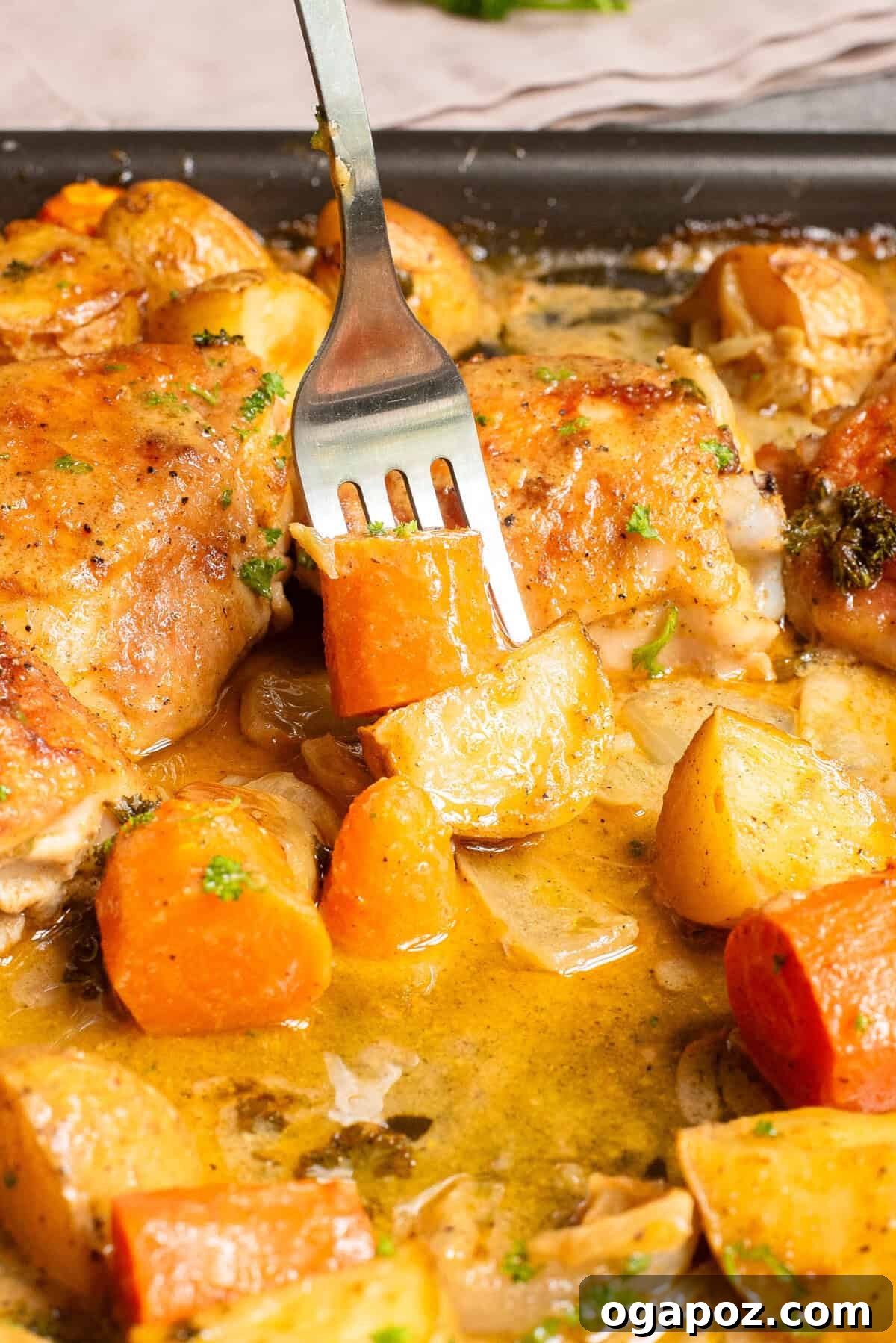 Golden Honey Mustard Sheet Pan Chicken Thighs 9 Sheet Pan Honey Mustard Chicken Thighs with a fork, showing tender chicken and vegetables