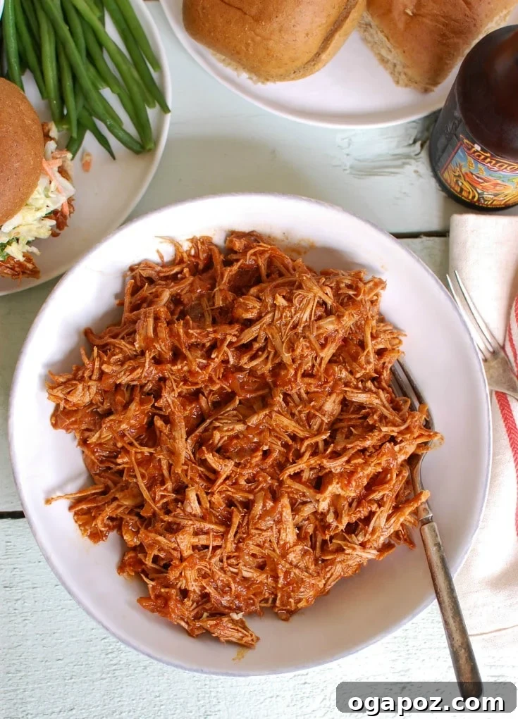 Fall-Apart Tender Slow Cooker BBQ Pulled Pork 3 Slow Cooker Barbecue Pulled Pork in bowl