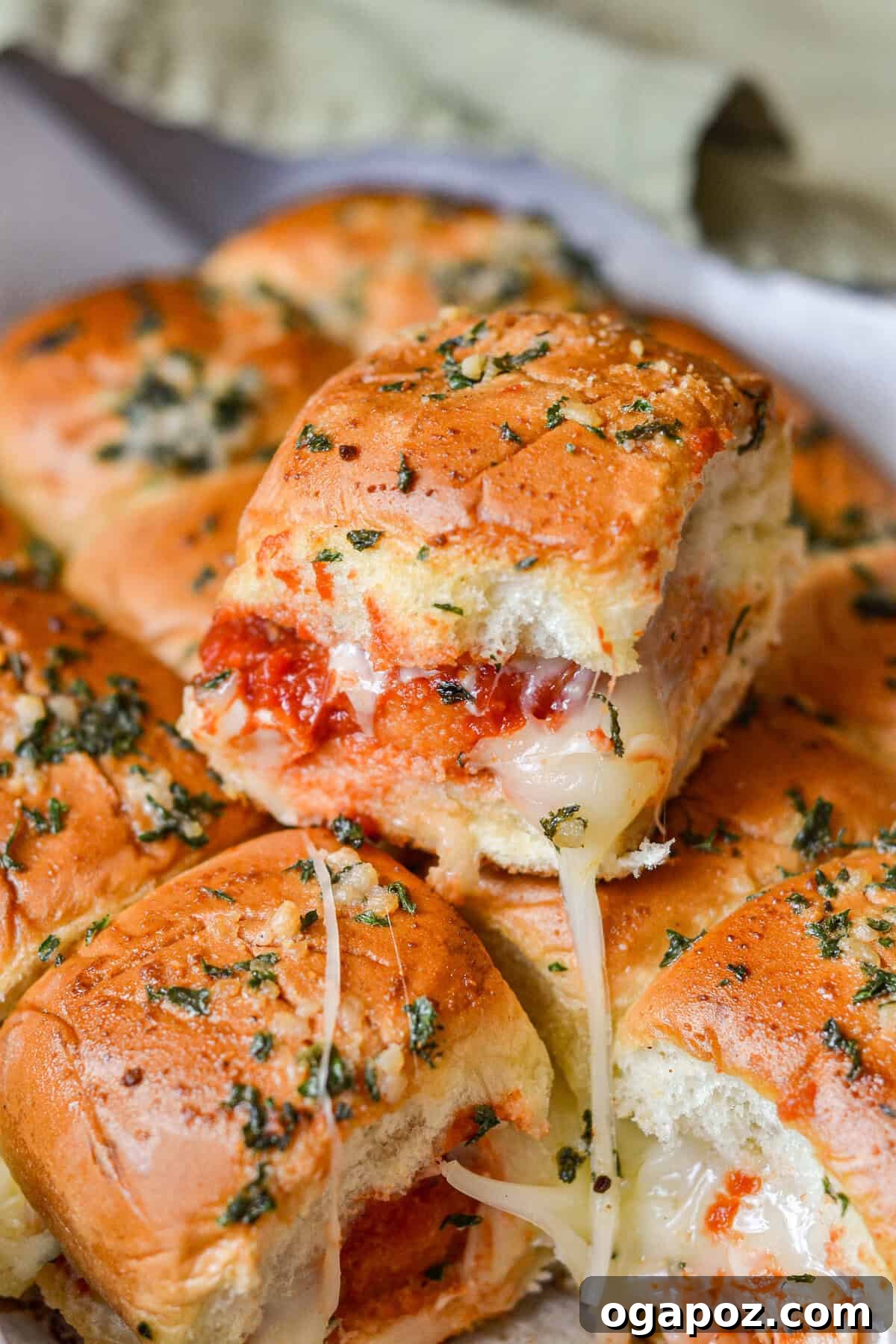 No-Fuss Cheesy Chicken Parm Sliders 2 Easy Chicken Parmesan Sliders in a baking dish