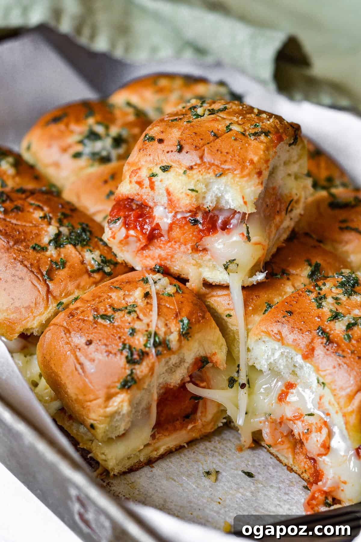 No-Fuss Cheesy Chicken Parm Sliders 12 Easy Chicken Parmesan Sliders on a baking sheet
