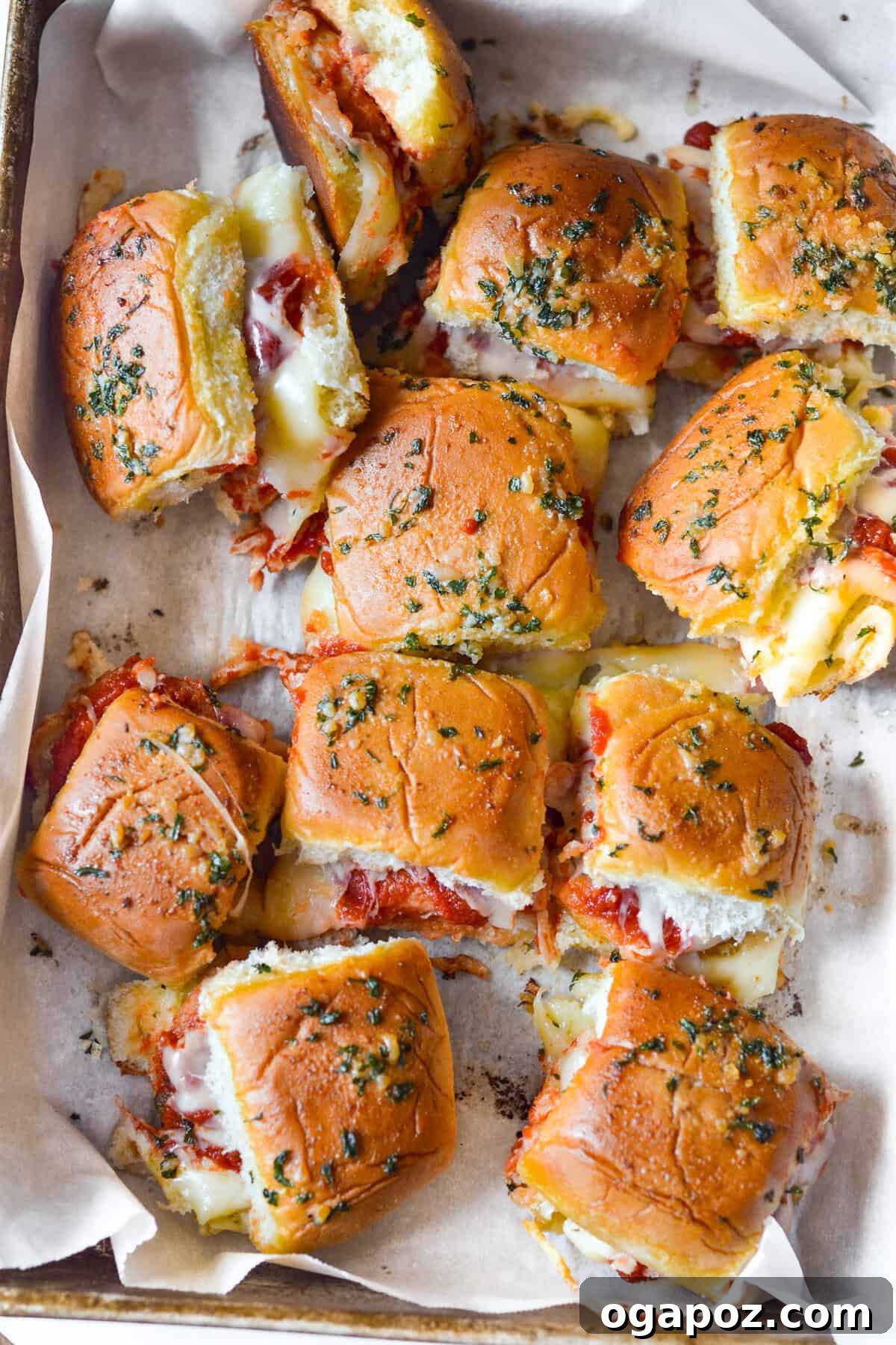 No-Fuss Cheesy Chicken Parm Sliders 5 Easy Chicken Parmesan Sliders on a baking sheet