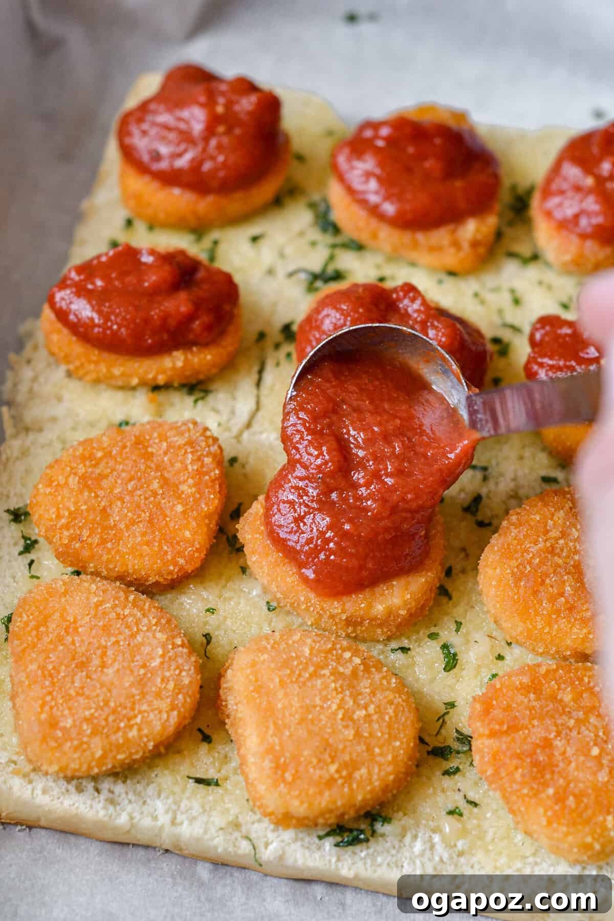 No-Fuss Cheesy Chicken Parm Sliders 9 Easy Chicken Parmesan Sliders with sauce going on chicken