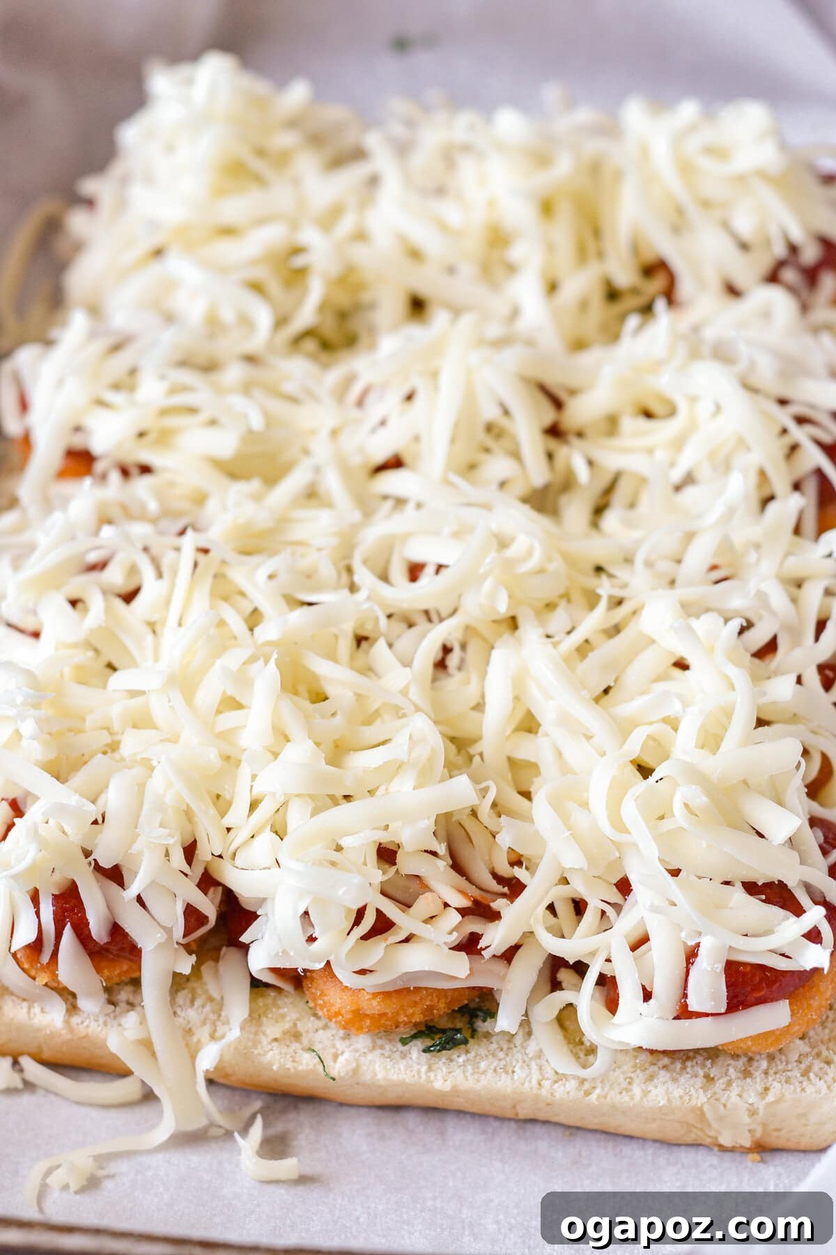 No-Fuss Cheesy Chicken Parm Sliders 10 Easy Chicken Parmesan Sliders adding cheese