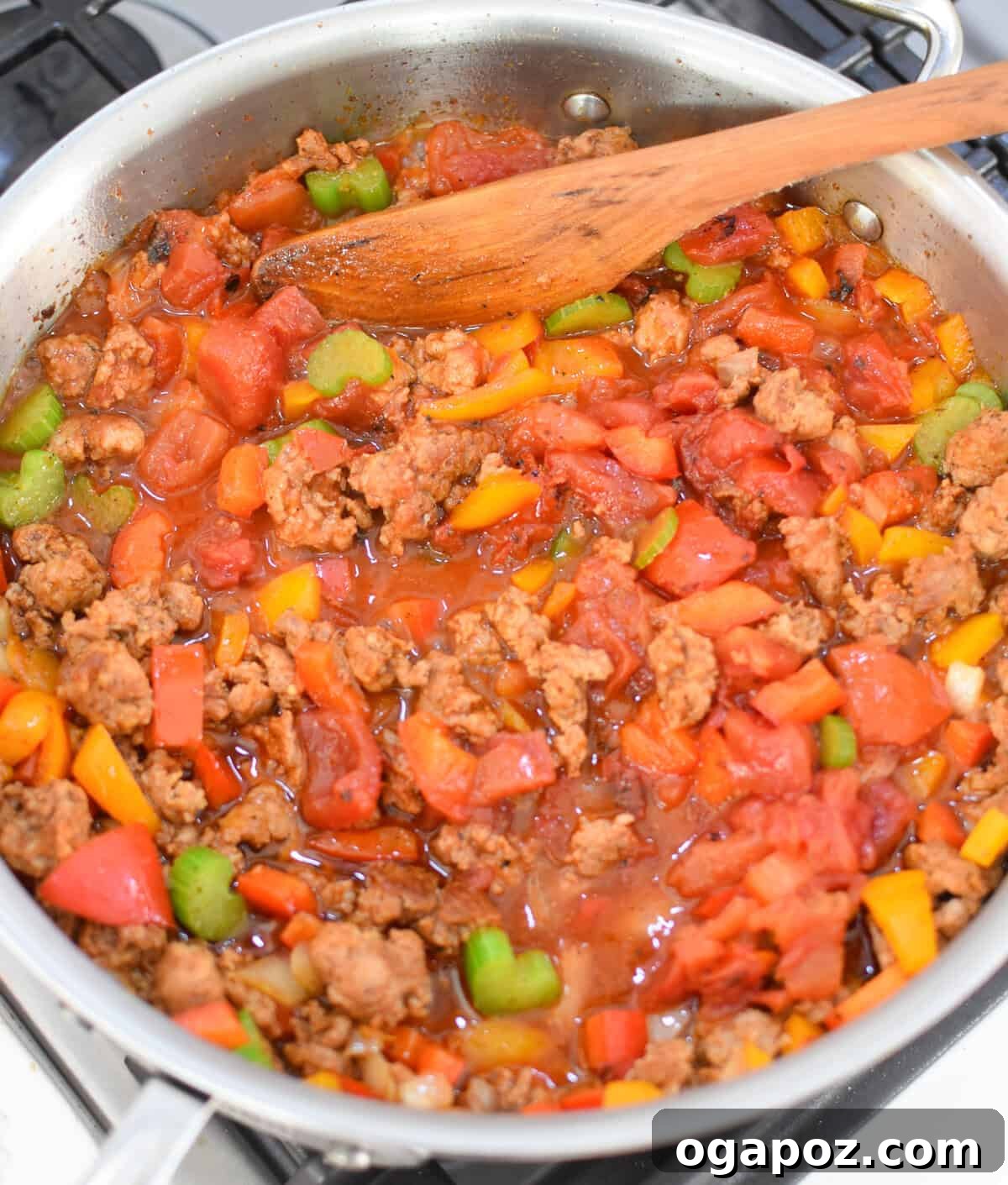 Spicy Creamy Cajun Sausage Rice Skillet 7 Creamy Cajun Sausage Rice Skillet with tomatoes in a skillet