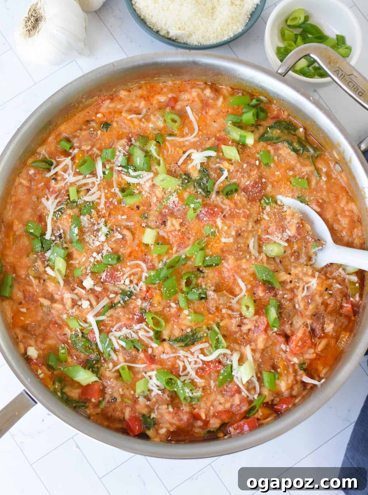 Spicy Creamy Cajun Sausage Rice Skillet 9 Creamy Cajun Sausage Rice Skillet with cream in it