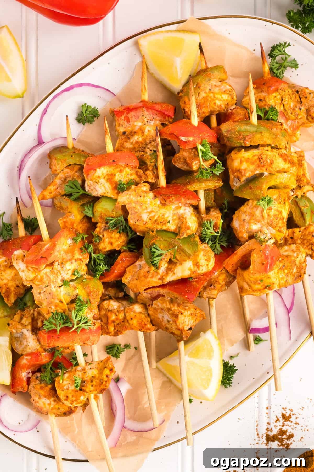 Zesty Grilled Chicken Tikka Skewers 11 Grilled Chicken Tikka Kebabs on skewers, beautifully plated and ready to serve