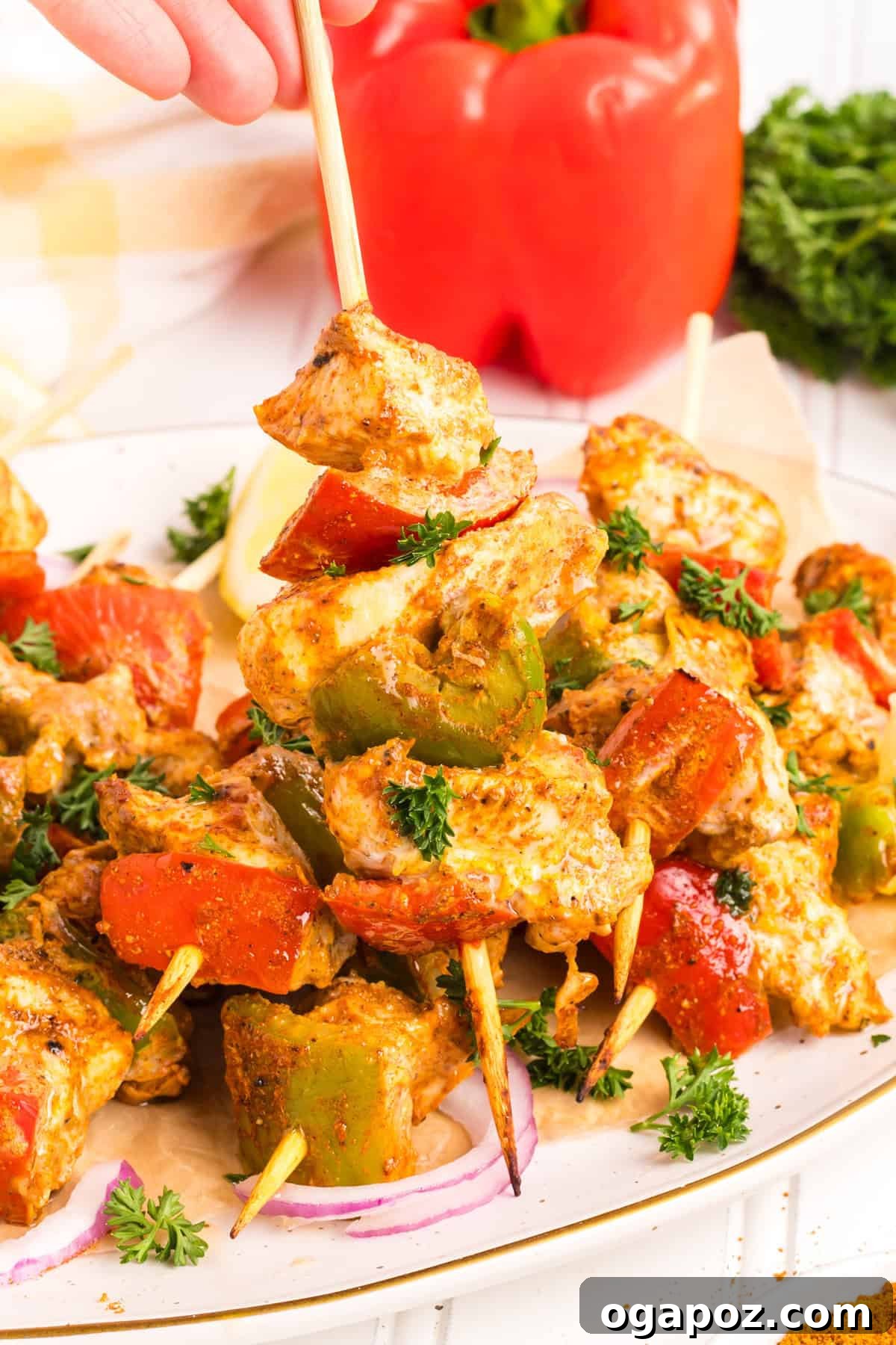 Zesty Grilled Chicken Tikka Skewers 3 Colorful Chicken Tikka Kebabs threaded with red and green bell peppers