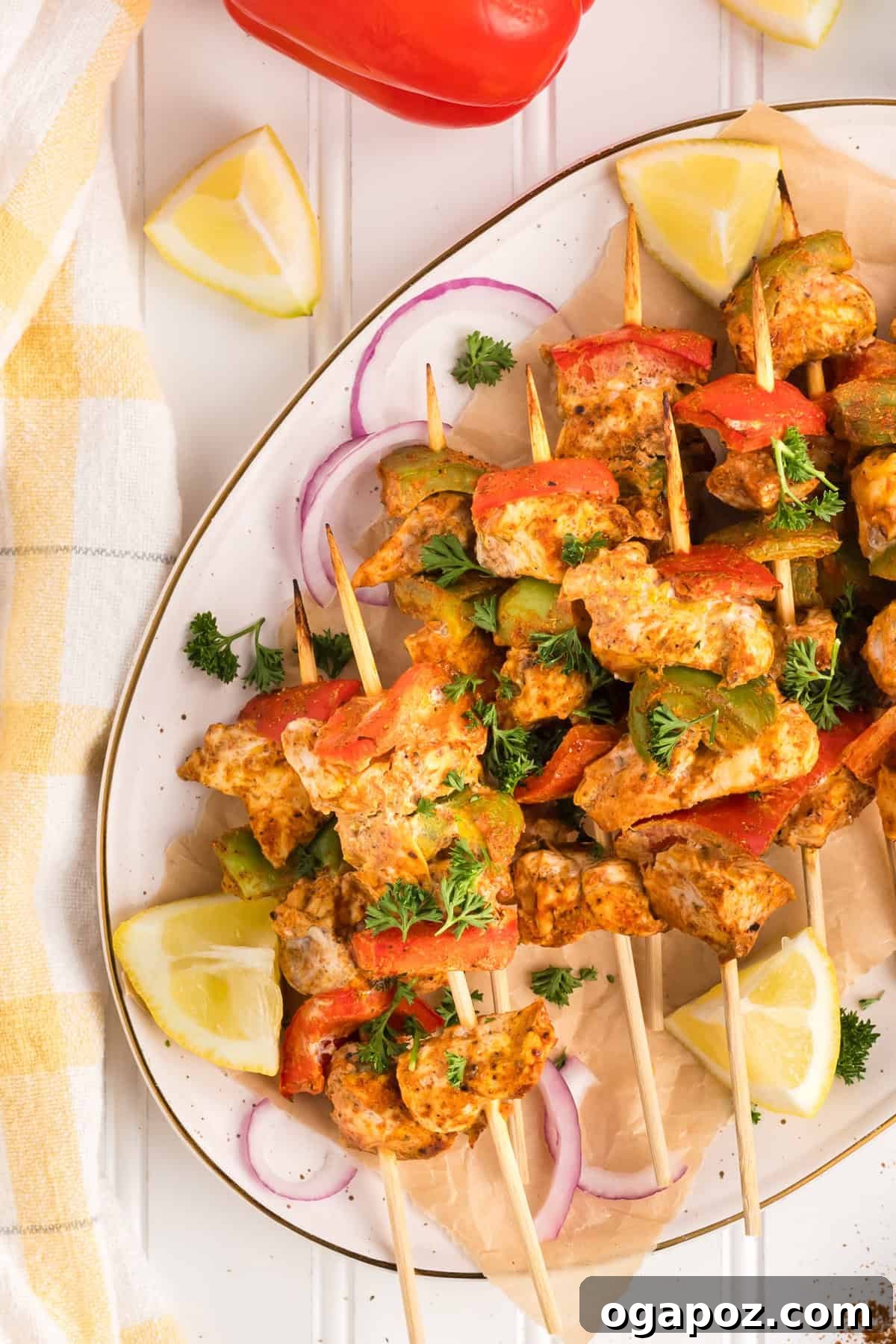 Zesty Grilled Chicken Tikka Skewers 5 Perfectly cooked Chicken Tikka Kebabs arranged artfully on a serving platter