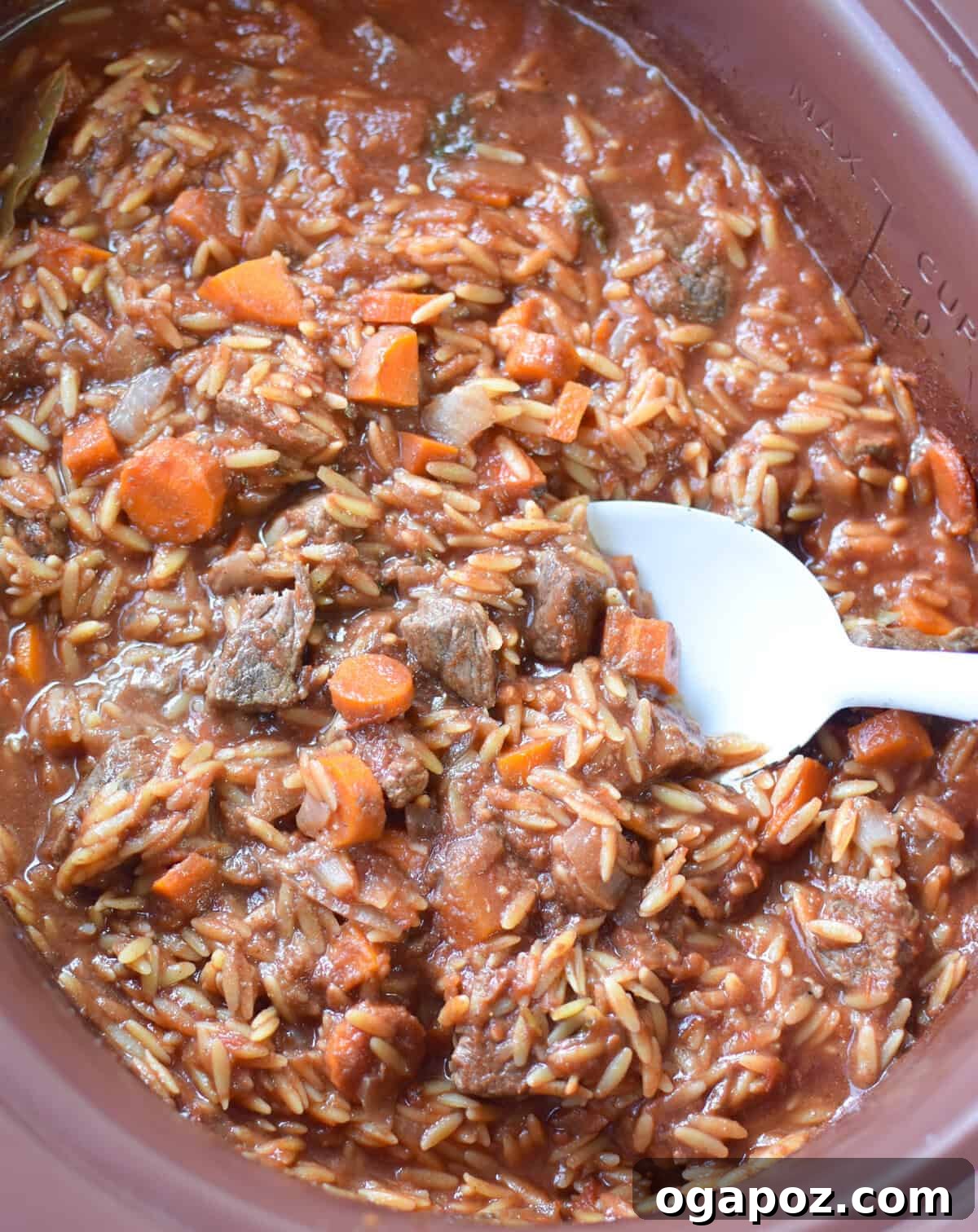 Hearty Greek Giouvetsi Beef Orzo Stew 3 Greek Beef Stew with Orzo cooking in a slow cooker
