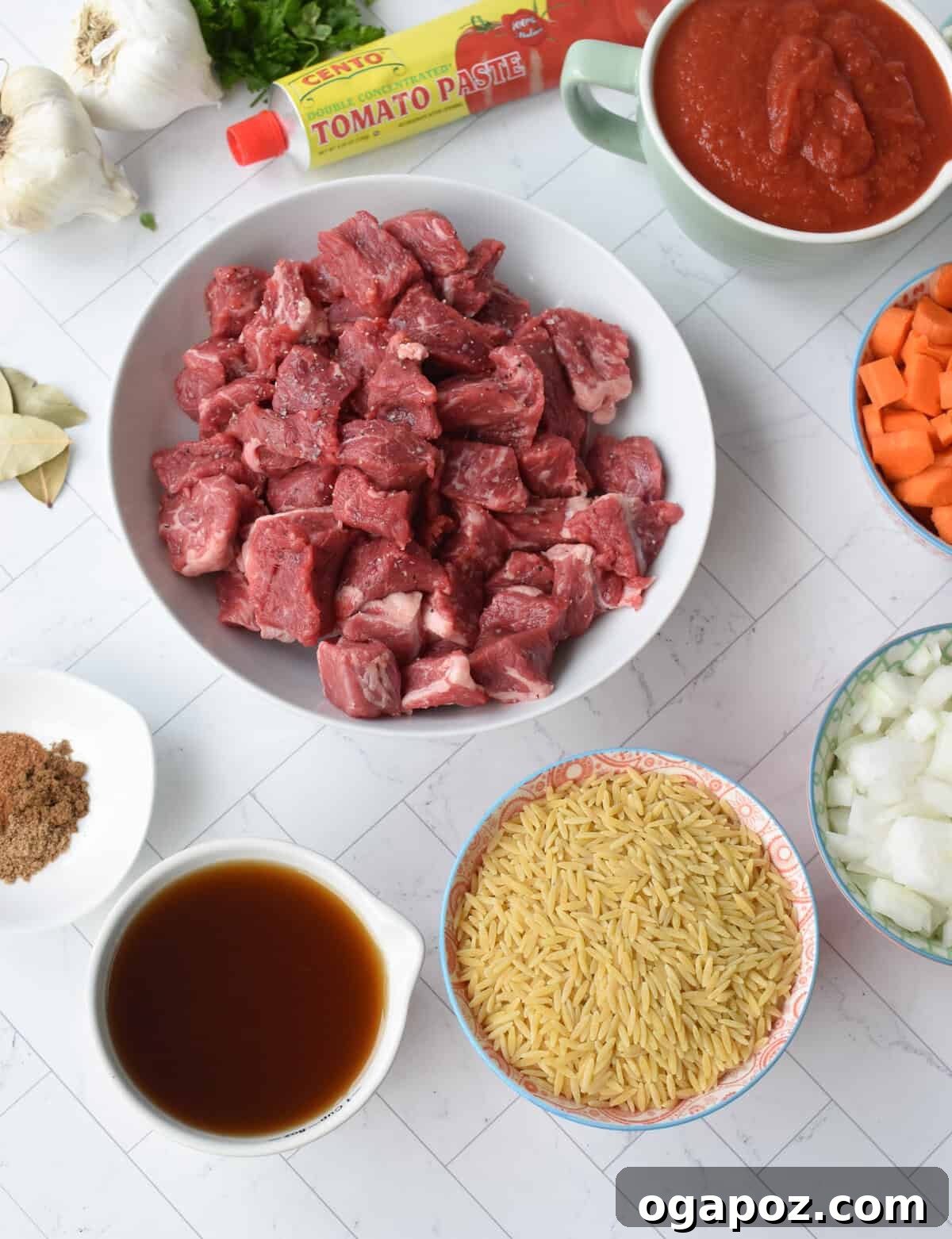 Hearty Greek Giouvetsi Beef Orzo Stew 6 Assorted ingredients for Greek Beef Stew with Orzo including beef, vegetables, and spices