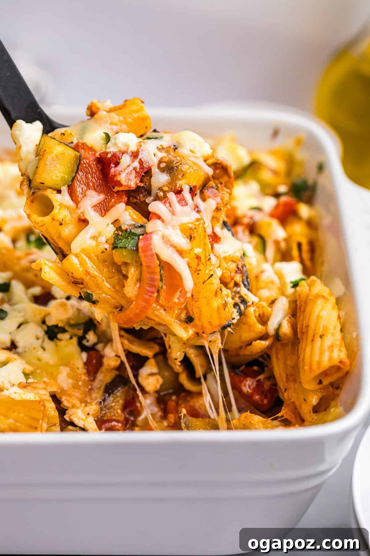 Golden Mediterranean Garden Pasta Bake 2 Mediterranean Roasted Vegetable Pasta Bake in a white pan, ready to be served