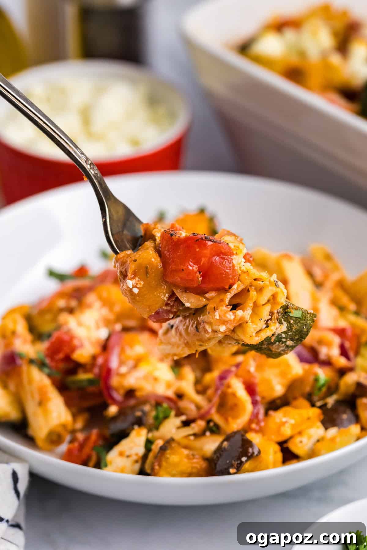 Golden Mediterranean Garden Pasta Bake 4 Mediterranean Roasted Vegetable Pasta Bake pasta being lifted with a fork