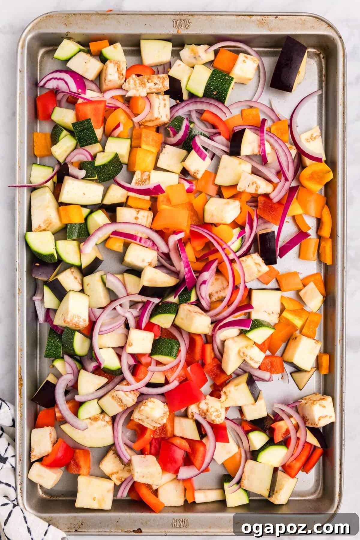 Golden Mediterranean Garden Pasta Bake 5 Mediterranean Roasted Vegetable Pasta Bake vegetables seasoned on a baking sheet
