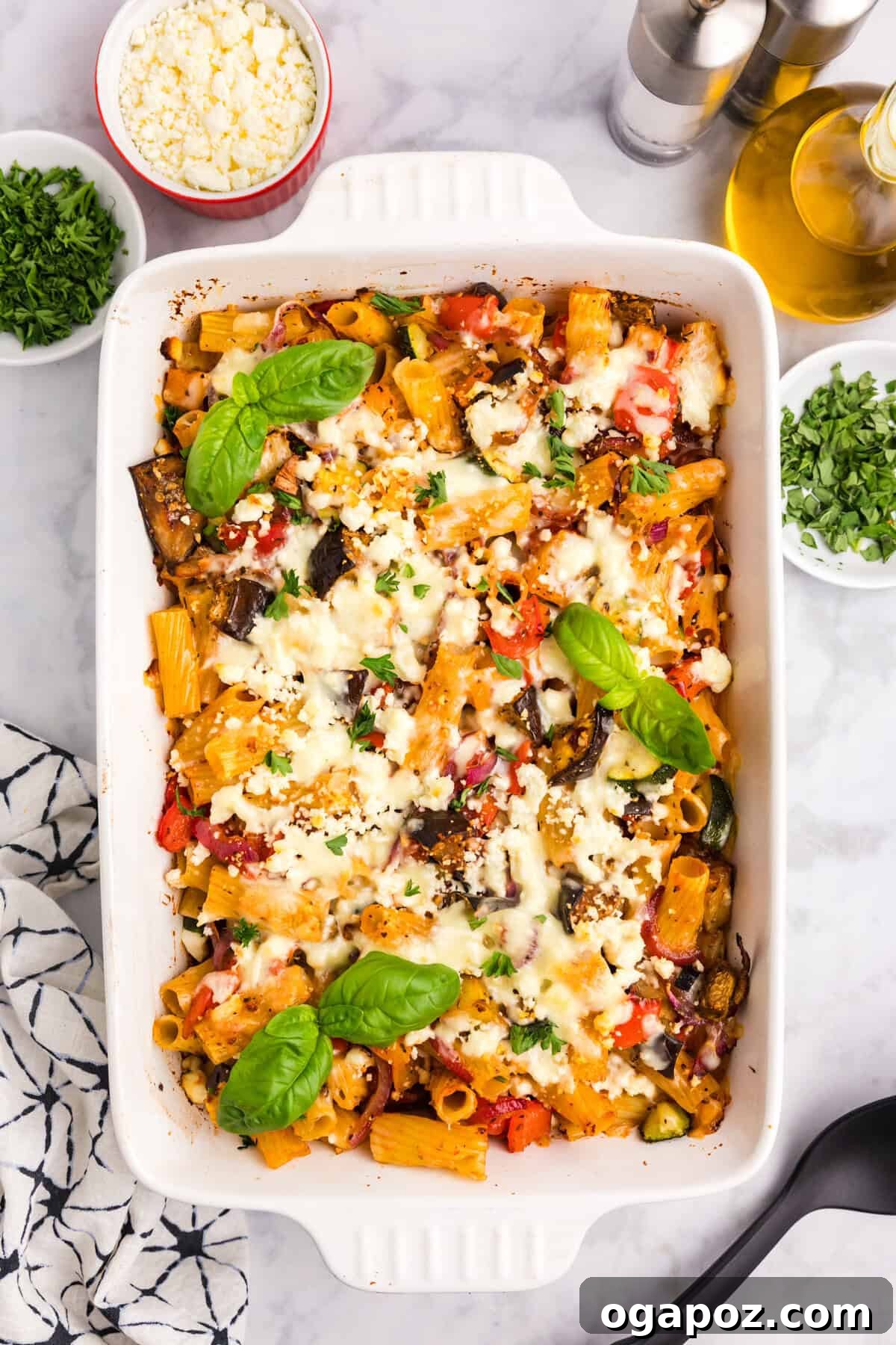 Golden Mediterranean Garden Pasta Bake 8 Mediterranean Roasted Vegetable Pasta Bake garnished with fresh basil