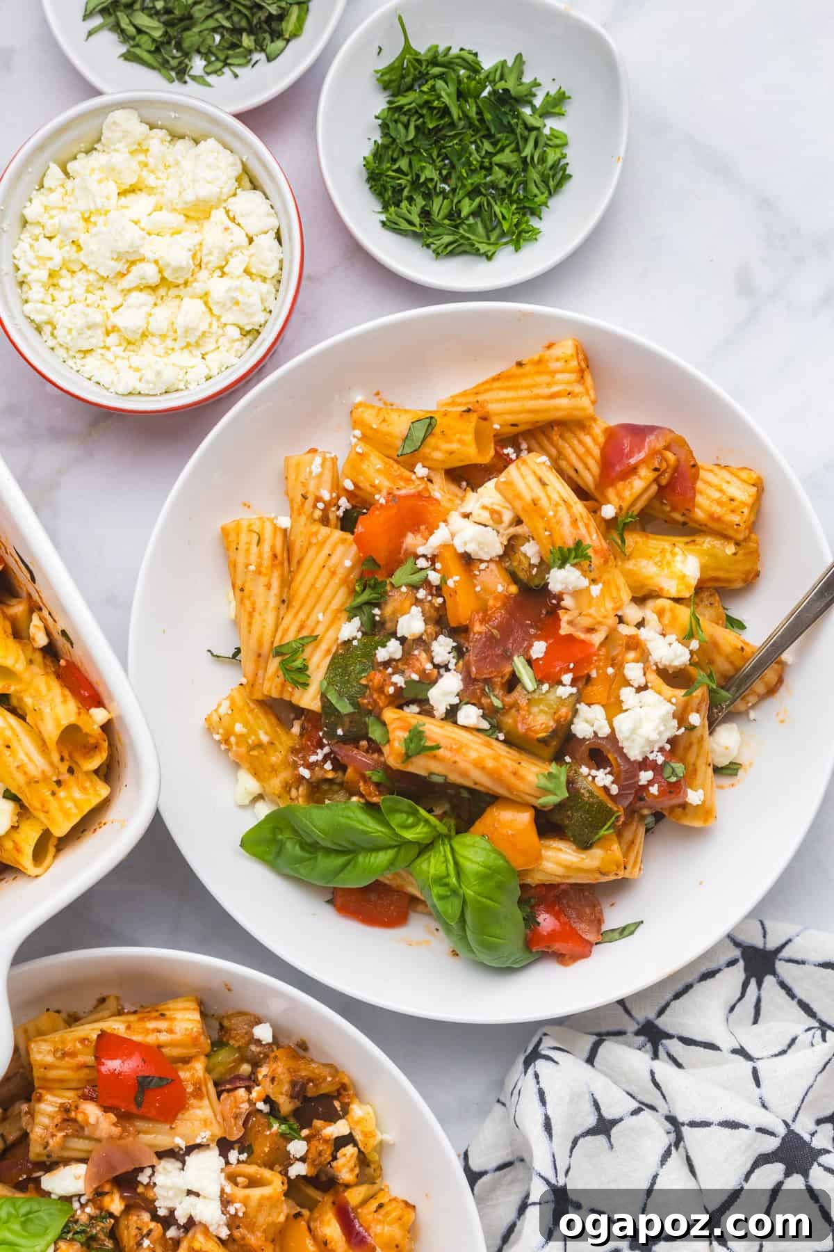 Golden Mediterranean Garden Pasta Bake 9 Mediterranean Roasted Vegetable Pasta Bake served in a bowl with fresh herbs