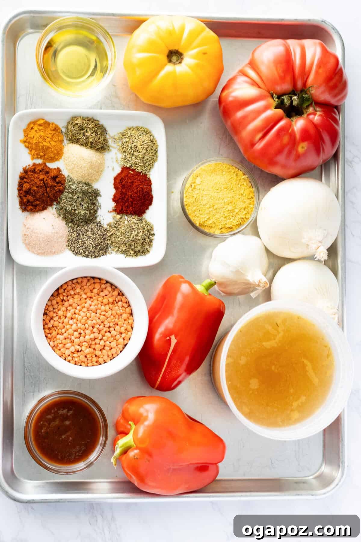 Comforting Lentil Tomato Soup 6 Close-up of fresh ingredients for Lentil Tomato Soup, including tomatoes, bell peppers, garlic, and lentils.