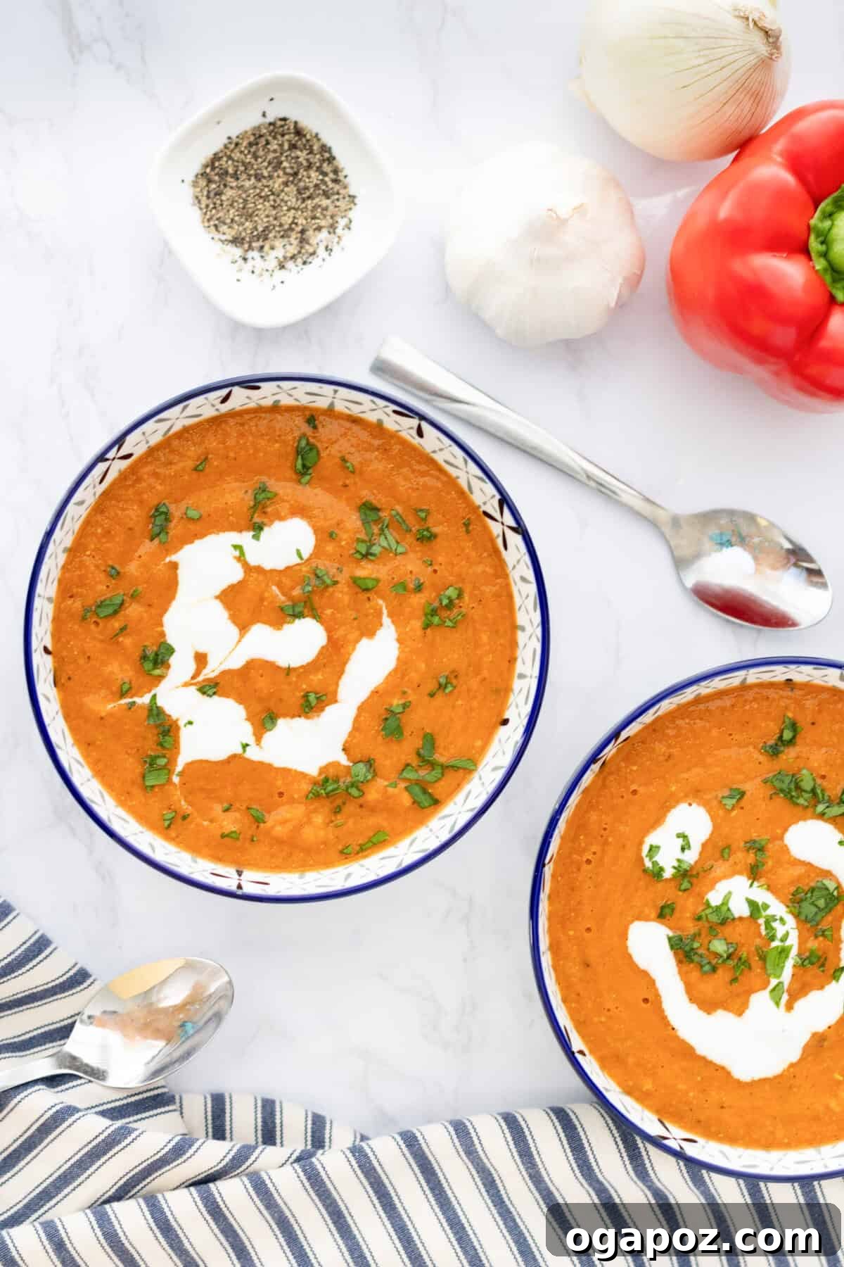 Comforting Lentil Tomato Soup 10 Two bowls of Lentil Tomato Soup with spoons, ready to be eaten.