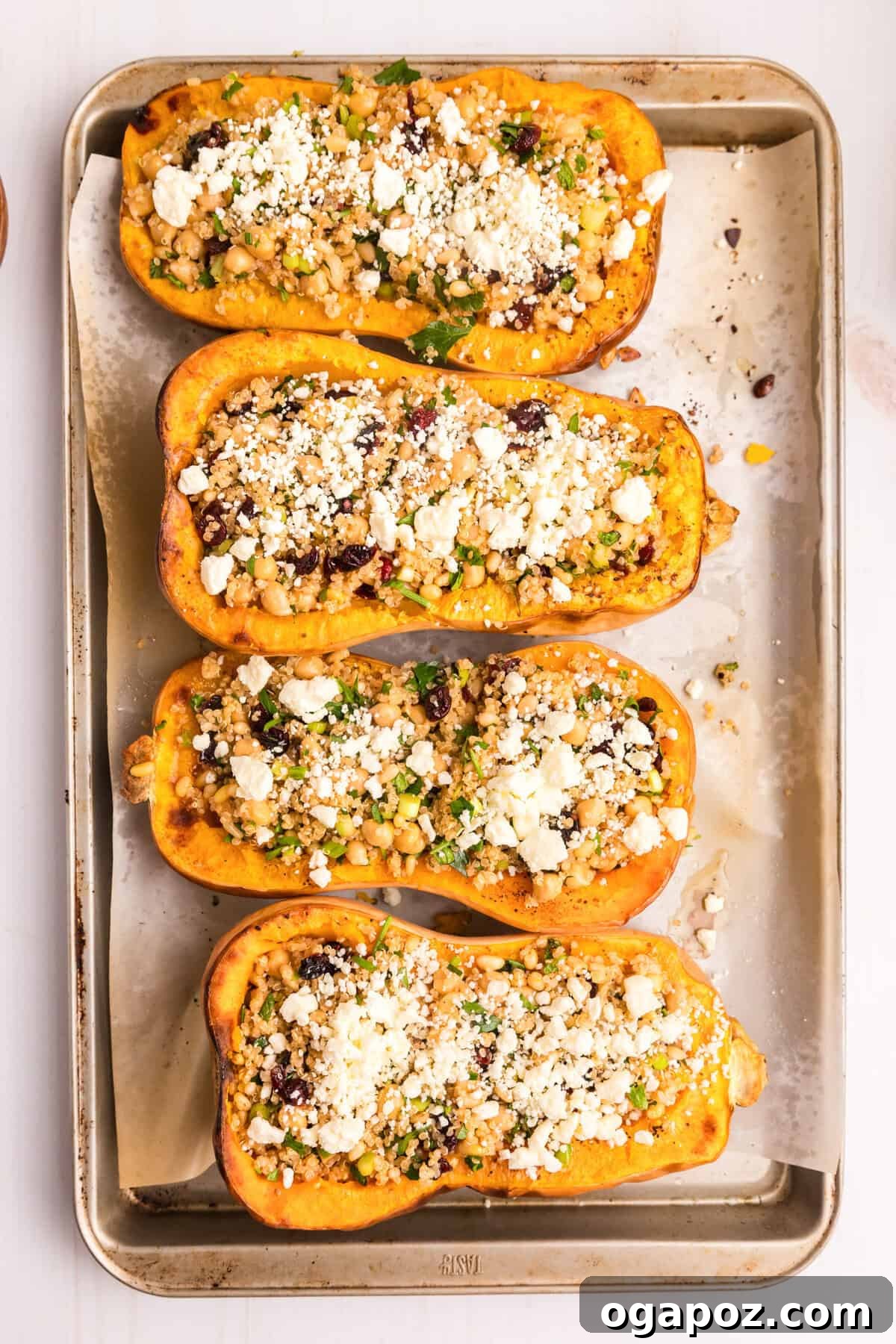 Flavorful Mediterranean Stuffed Butternut Squash Boats 11 Beautifully stuffed Mediterranean Butternut Squash halves on a plate, ready to be enjoyed