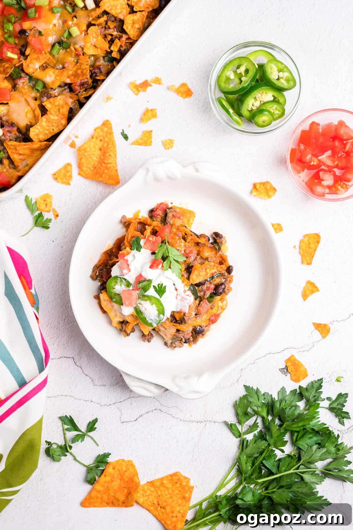 A slice of Doritos Taco Casserole on a white plate