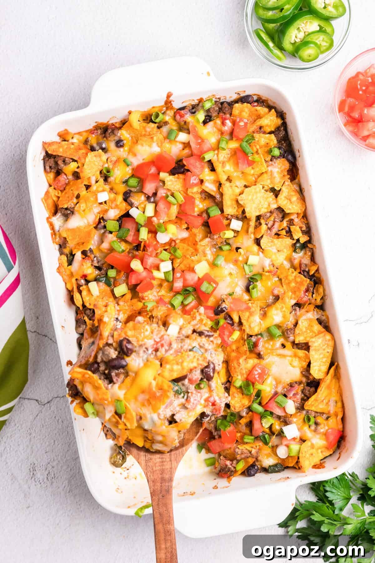 Doritos Taco Casserole baking in a white casserole dish