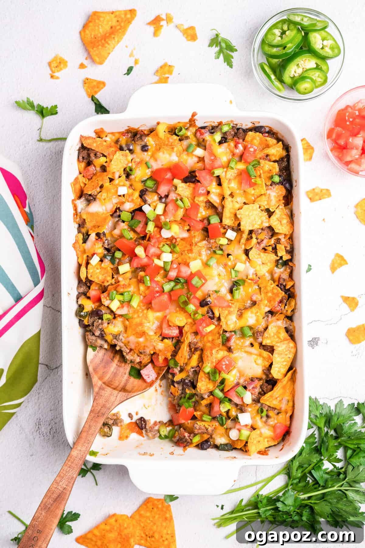 A spoon scooping out a serving of Doritos Taco Casserole