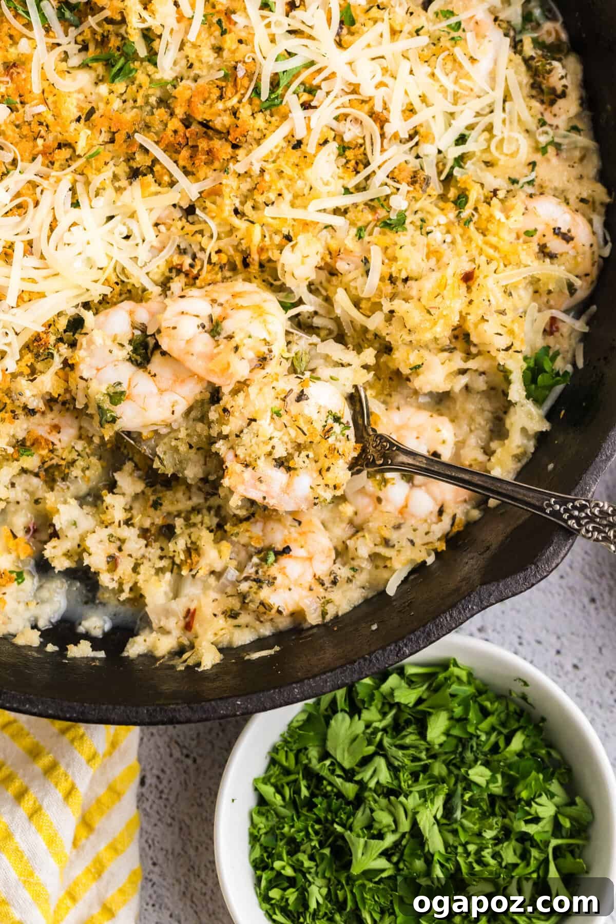 Crispy Golden Shrimp Made Simple 12 Easy Breaded Shrimp in a cast iron skillet with a spoon