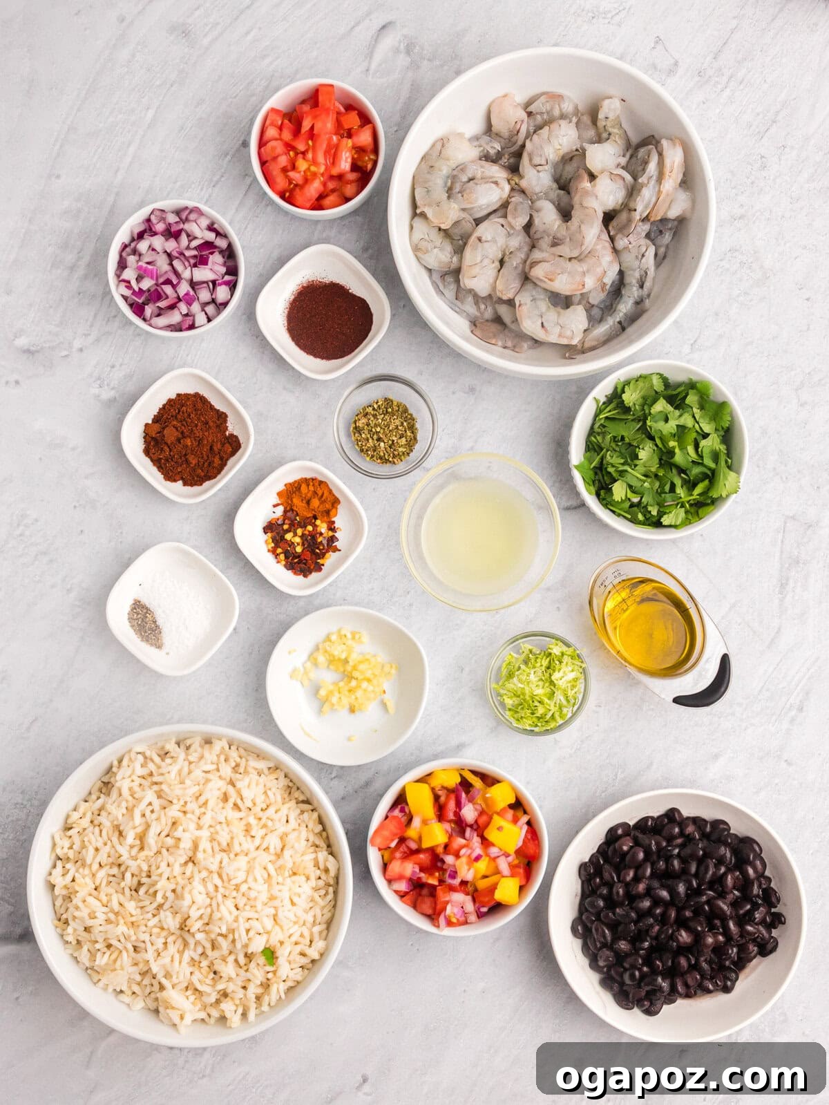 Sizzling Chili Prawns 5 Array of fresh ingredients for Spicy Shrimp recipe, including spices, shrimp, and lime.
