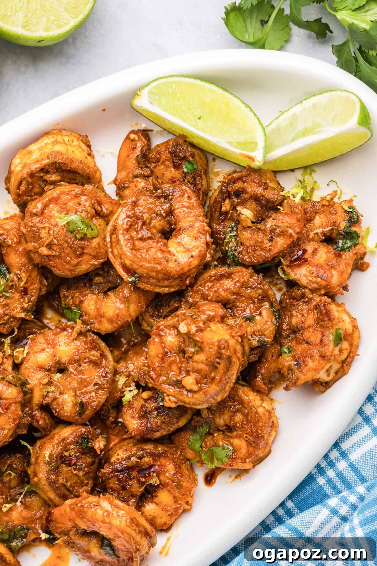 Sizzling Chili Prawns 6 Perfectly pan-seared Spicy Shrimp on a pristine white platter.