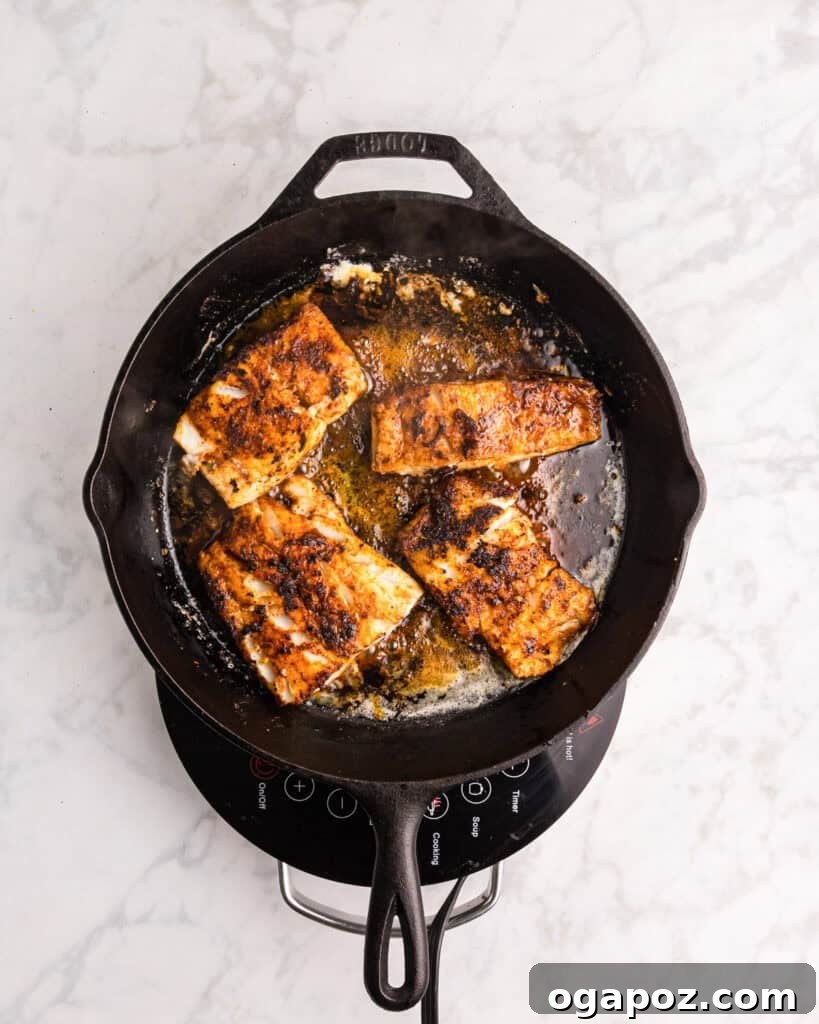 Quick Cajun Cod 11 Easy Blackened Cod in a skillet
