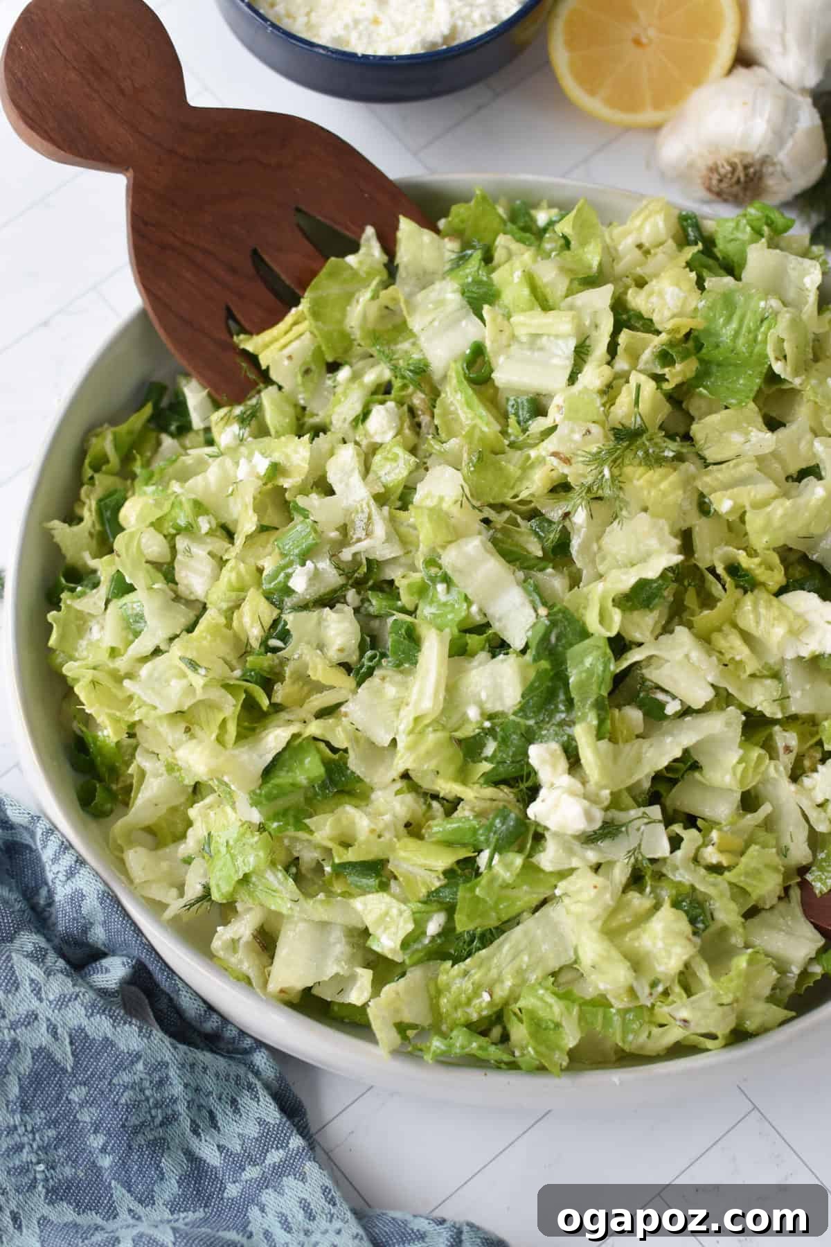 Vibrant Greek Lettuce and Dill Salad 11 Maroulosalata in a white ceramic bowl with a rustic background