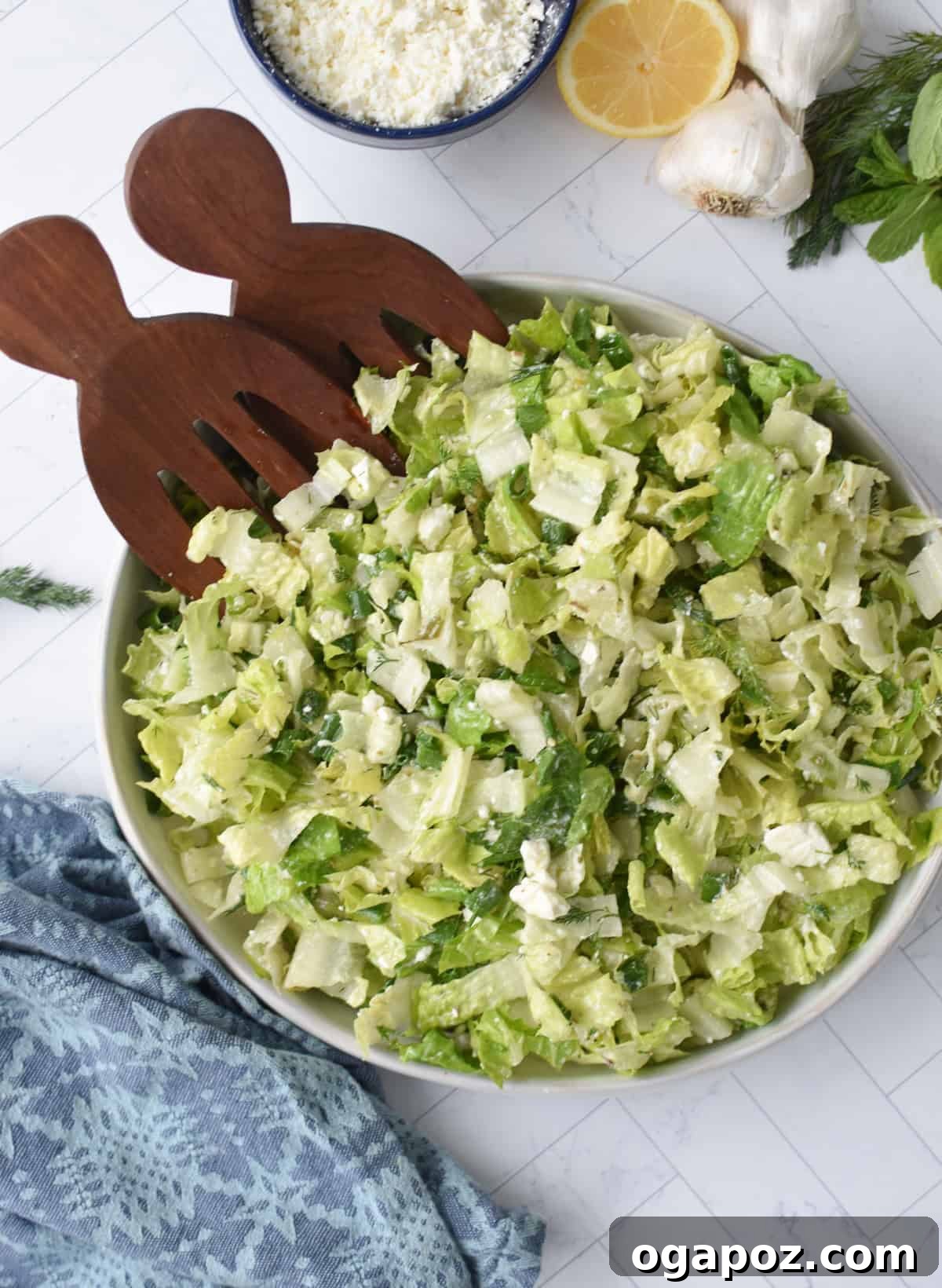 Vibrant Greek Lettuce and Dill Salad 7 Maroulosalata in a bowl with wooden serving utensils