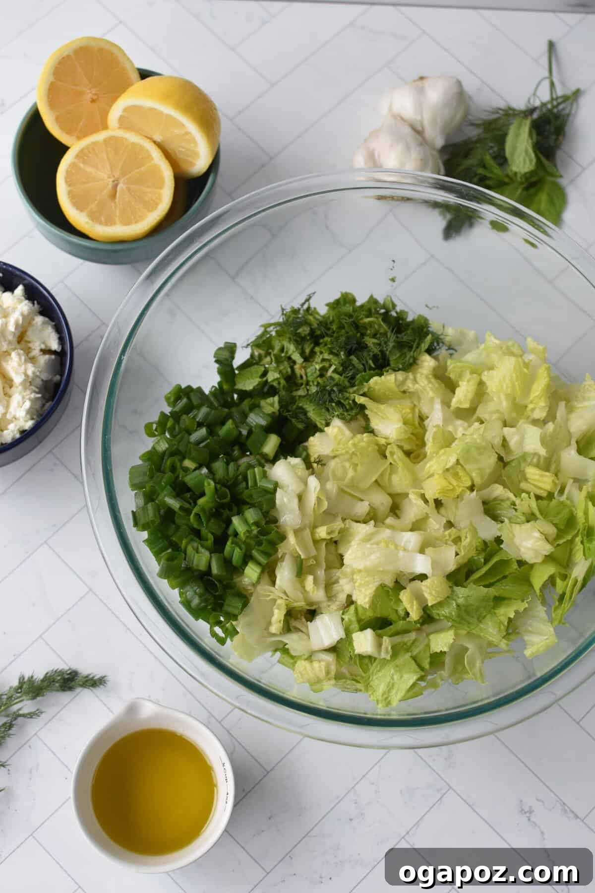Vibrant Greek Lettuce and Dill Salad 8 Close-up of chopped romaine lettuce, dill, mint, and green onions in a bowl