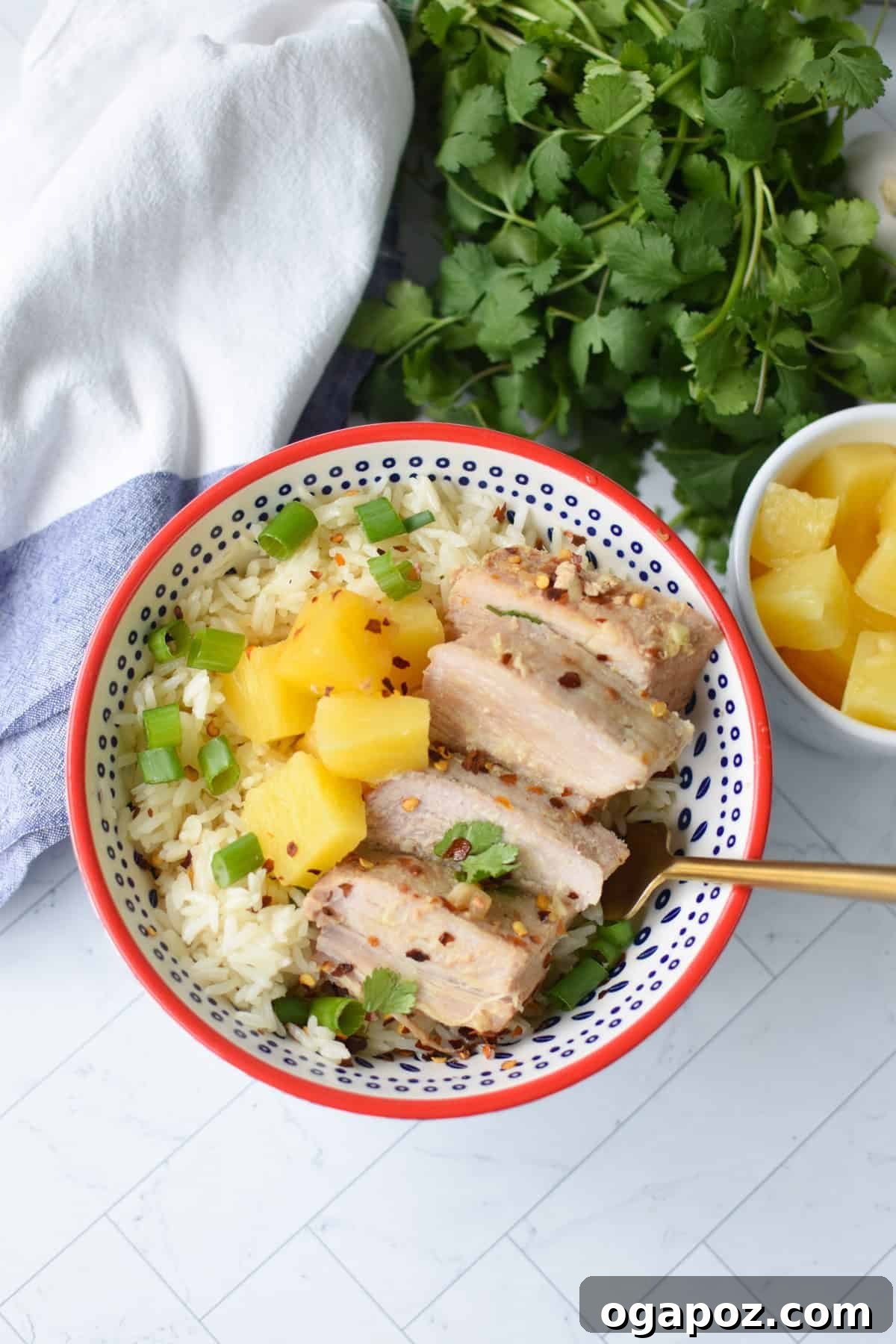 Slow Cooker Pineapple Pork Loin in bowl with fork