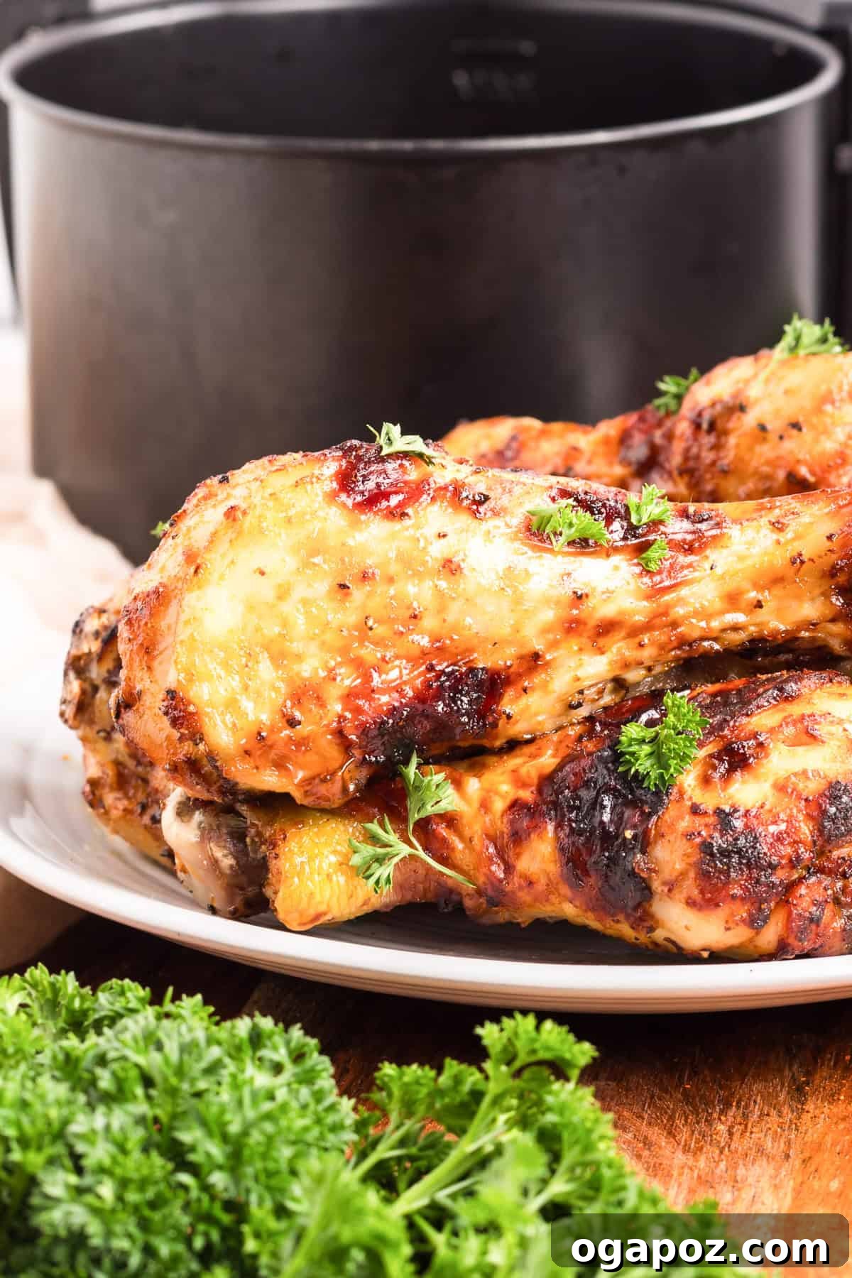 Extra Crispy Air Fried Drumsticks 6 Crispy Air Fryer Chicken Legs served on a white plate with sides