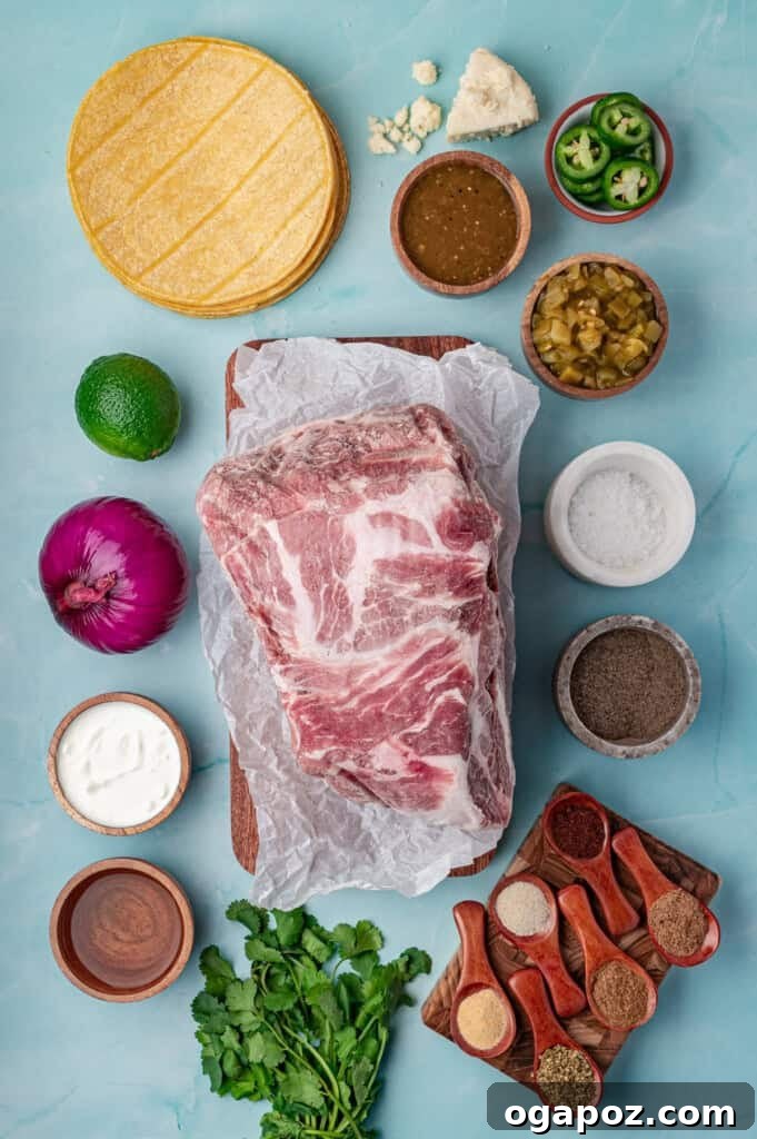 Tender Slow Cooker Pulled Pork Tacos 5 A vibrant display of fresh ingredients for Slow Cooker Pulled Pork Tacos, including pork shoulder, spices, green chiles, and salsa verde