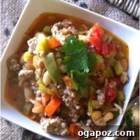 A tantalizing image of the prepared Cajun Green Chili, garnished and ready to serve, inviting you to taste its rich flavors.