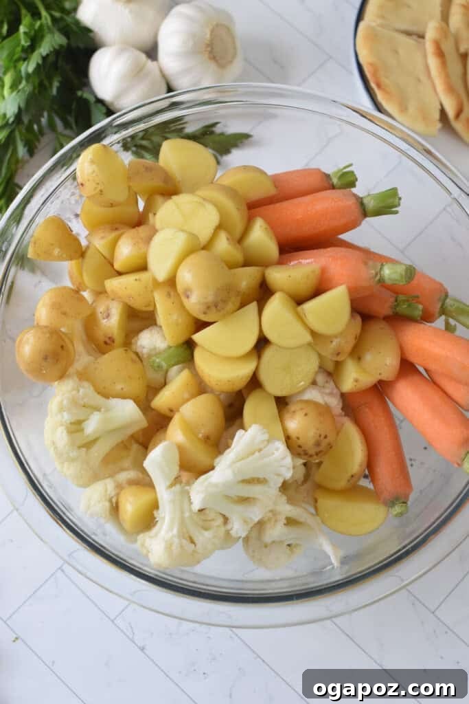 One Pan Roasted Zaatar Chicken 7 A vibrant mix of vegetables and potatoes seasoned with Za'atar, ready for roasting.