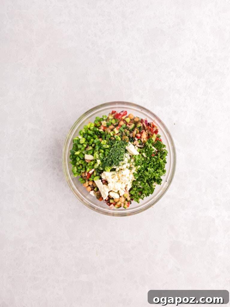 Sun-Kissed Mediterranean Tuna and Chickpea Delight 11 Mediterranean Tuna and Chickpea Salad ingredients in a bowl