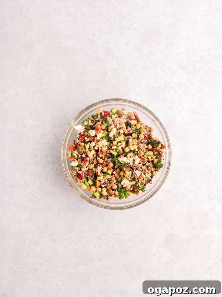 Sun-Kissed Mediterranean Tuna and Chickpea Delight 12 Mediterranean Tuna and Chickpea Salad in a large bowl