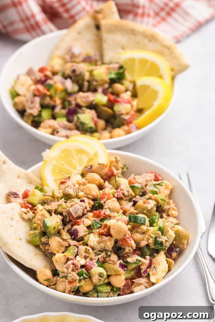 Sun-Kissed Mediterranean Tuna and Chickpea Delight 8 Mediterranean Tuna and Chickpea Salad in two bowls