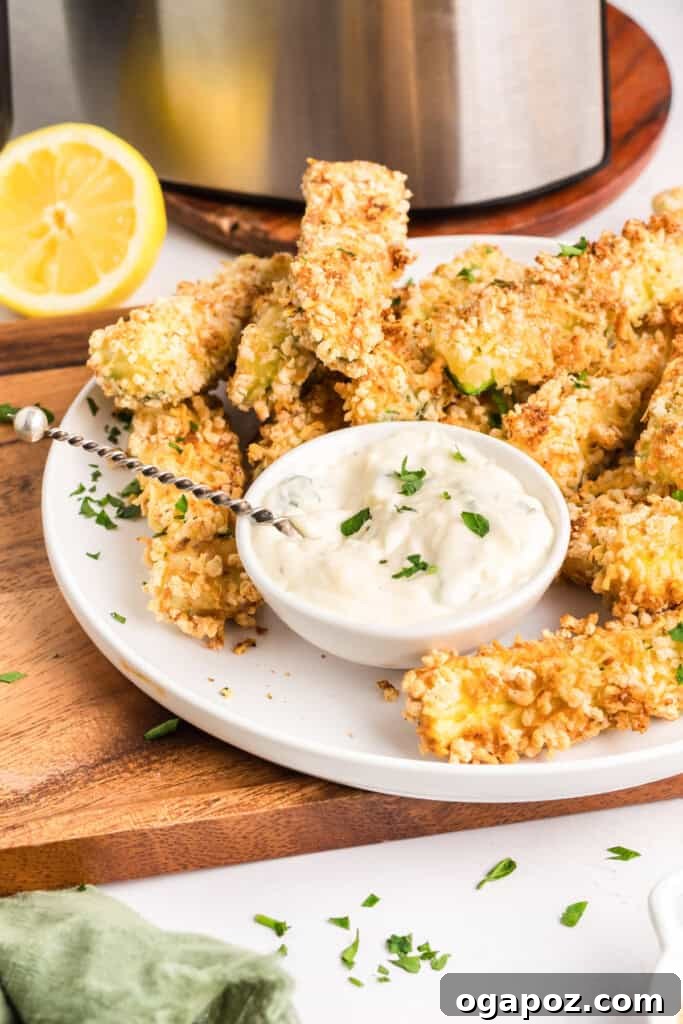 Crispy Air Fryer Zucchini Fries served on a plate with fresh parsley