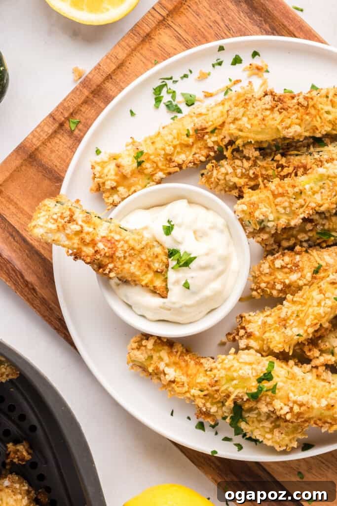 Air Fryer Zucchini Fries on a plate with dipping sauce