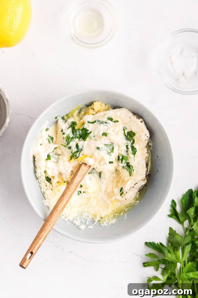 Garlic Lemon Aioli in a bowl with ingredients