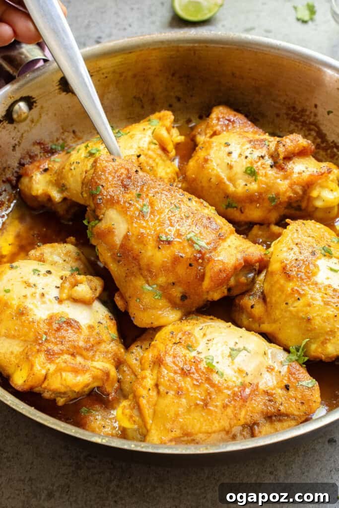 Golden Turmeric Chicken 10 Turmeric Chicken with fork in skillet