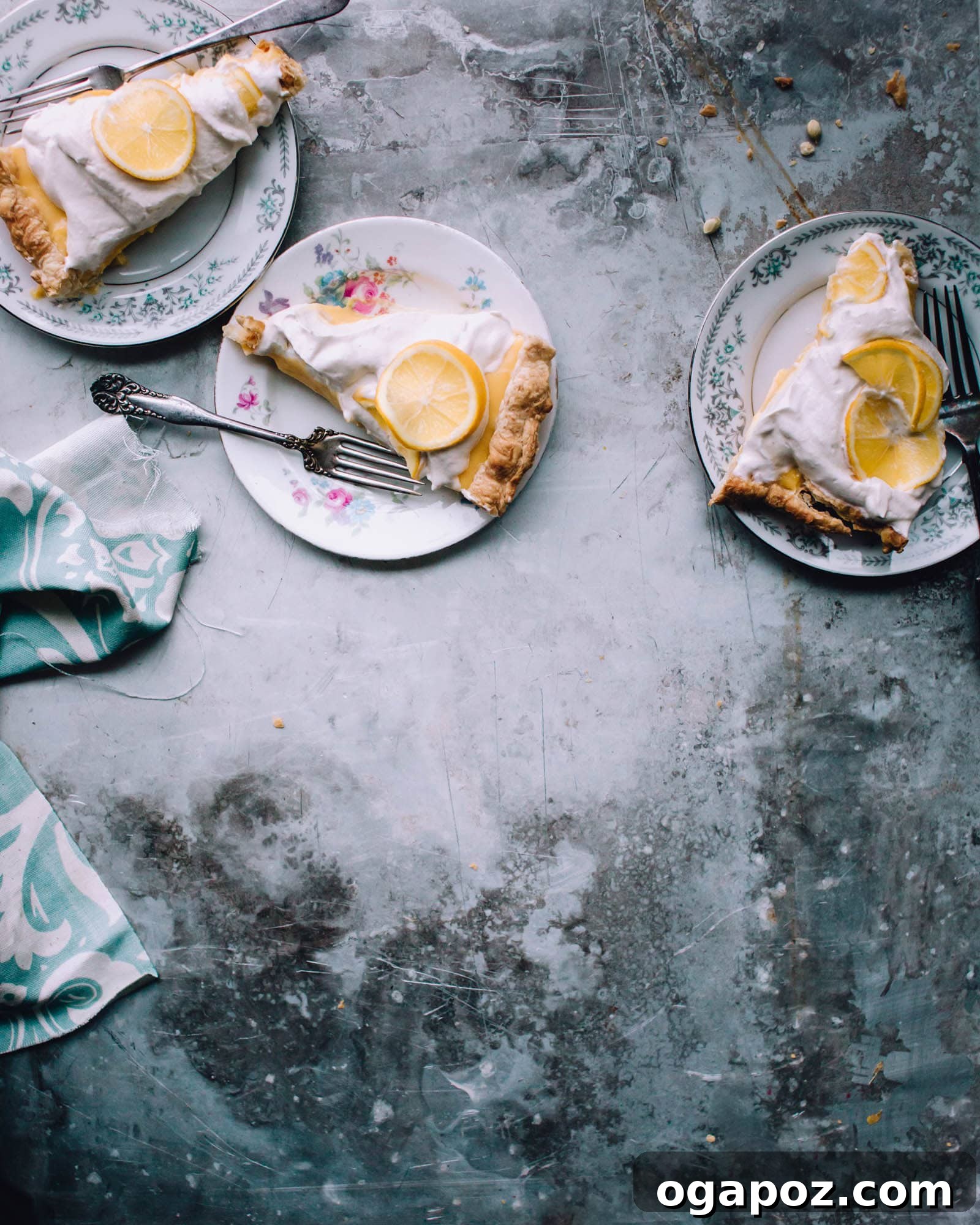 Effortless Zesty Lemon Tart 3 Slices of easy lemon tart on plates with whipped cream, ready to be enjoyed.