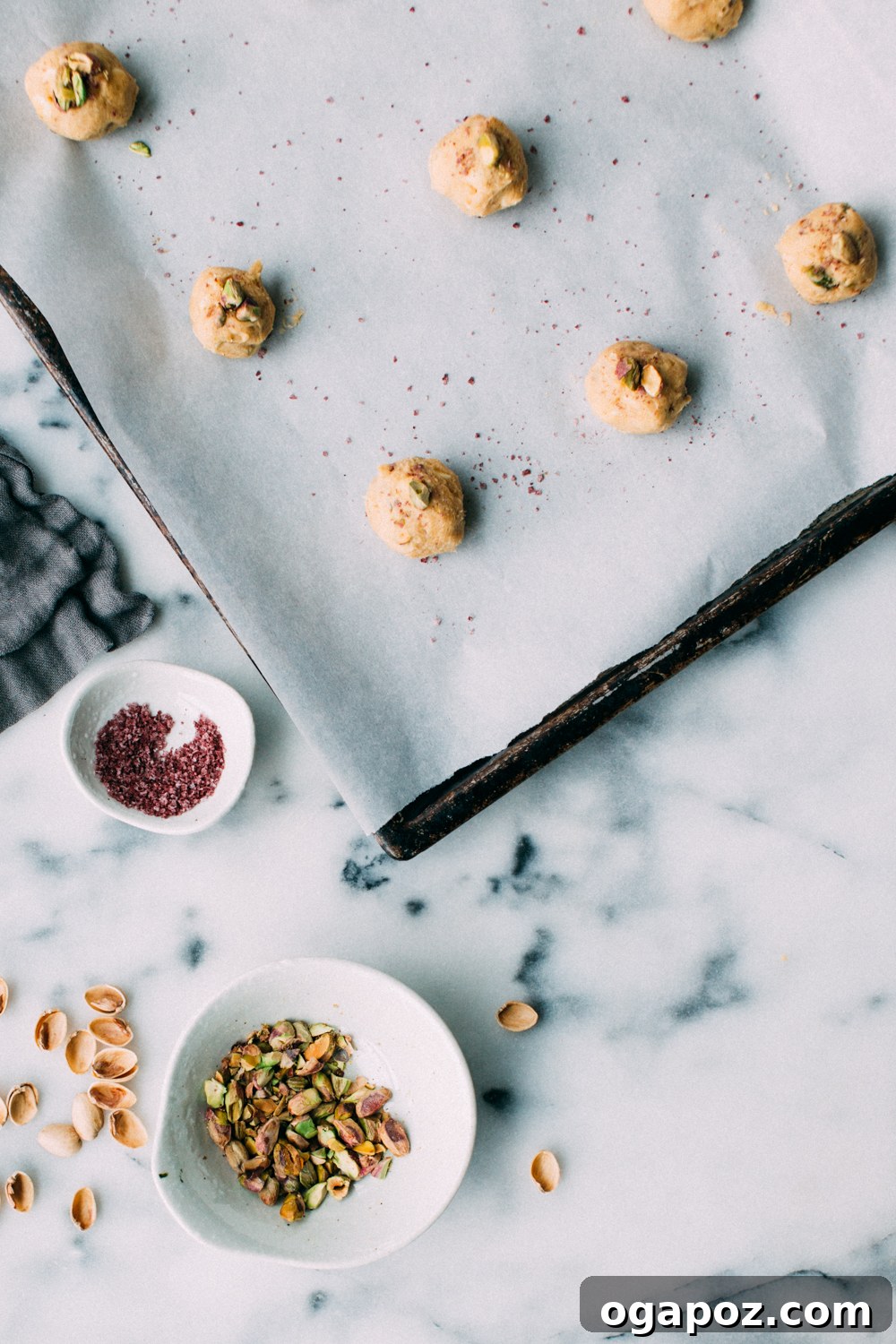 Lemony Pistachio White Chocolate Treasures 4 A plate of lemon pistachio white chocolate cookies, garnished with pink salt