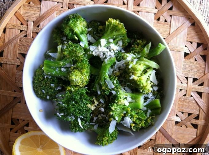 Roasted Lemon Parmesan Broccoli 3 A close-up shot of a bowl filled with perfectly cooked Lemon Parmesan Broccoli, ready to be served.