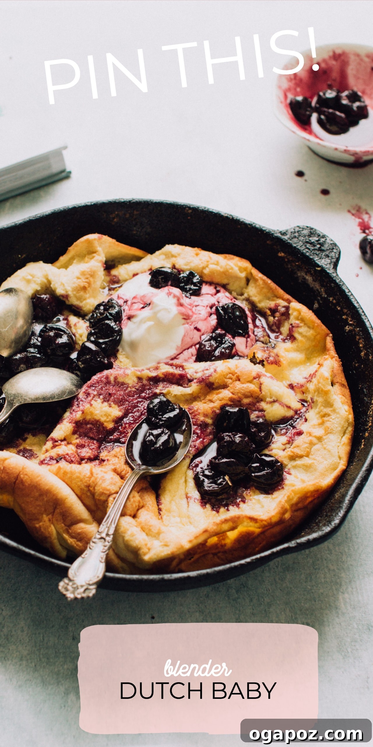 Effortless Blender Puff Pancake 3 Close-up of a Blender Dutch Baby with cherry topping and a dollop of yogurt