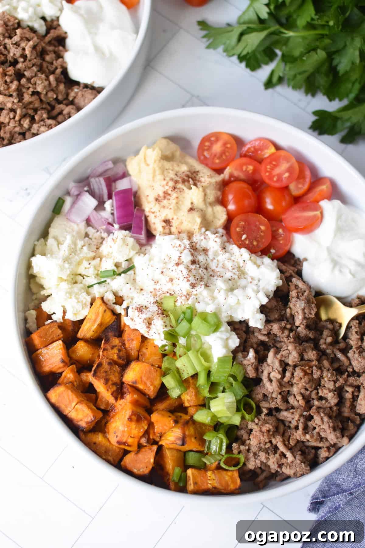 Ground Beef Sweet Potato Cottage Cheese Bowls 2 Sweet Potato Cottage Cheese Bowl, garnished and ready to eat, with a golden fork resting in the creamy layers.