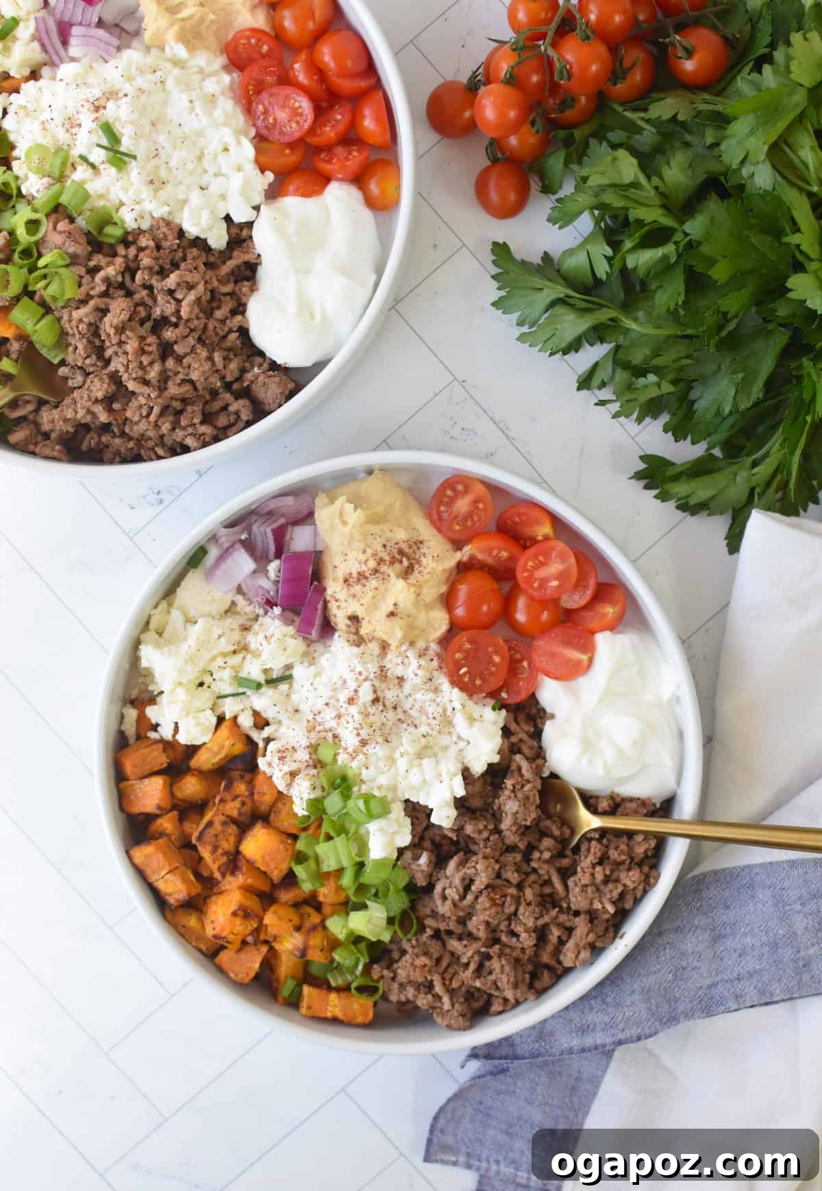 Ground Beef Sweet Potato Cottage Cheese Bowls 3 Two Sweet Potato Cottage Cheese Bowls with a napkin and fork, highlighting the fresh garnishes.